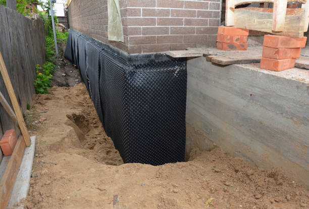 Happy homeowners after waterproofing job in Yorktown